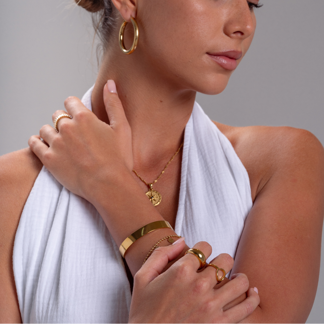 Bred Manchetarmbånd